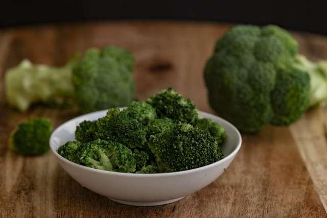 Pictured is a bowl of broccoli, a cruciferous vegetable that helps boost fiber intake.